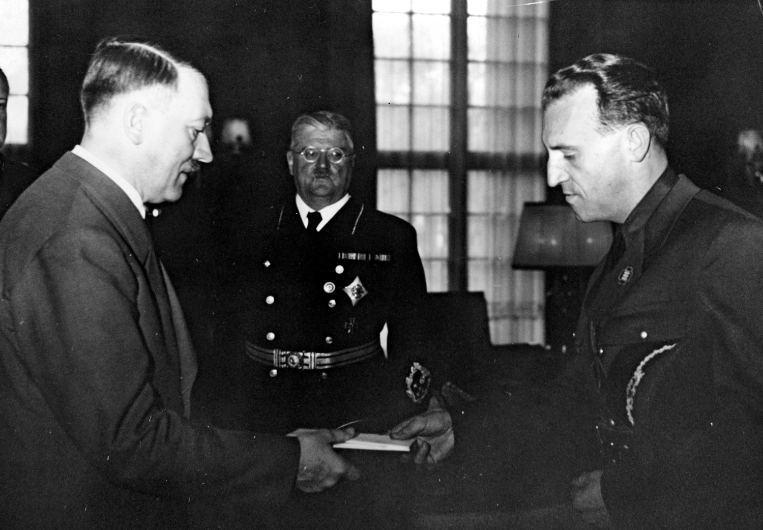 Adolf Hitler receives Romanian diplomat Constantin Grecianu in Berlin, with the secretary of state Otto Meisner between them